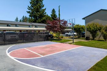 a basketball court in front of a building  at Quilceda Gardens, Marysville, WA